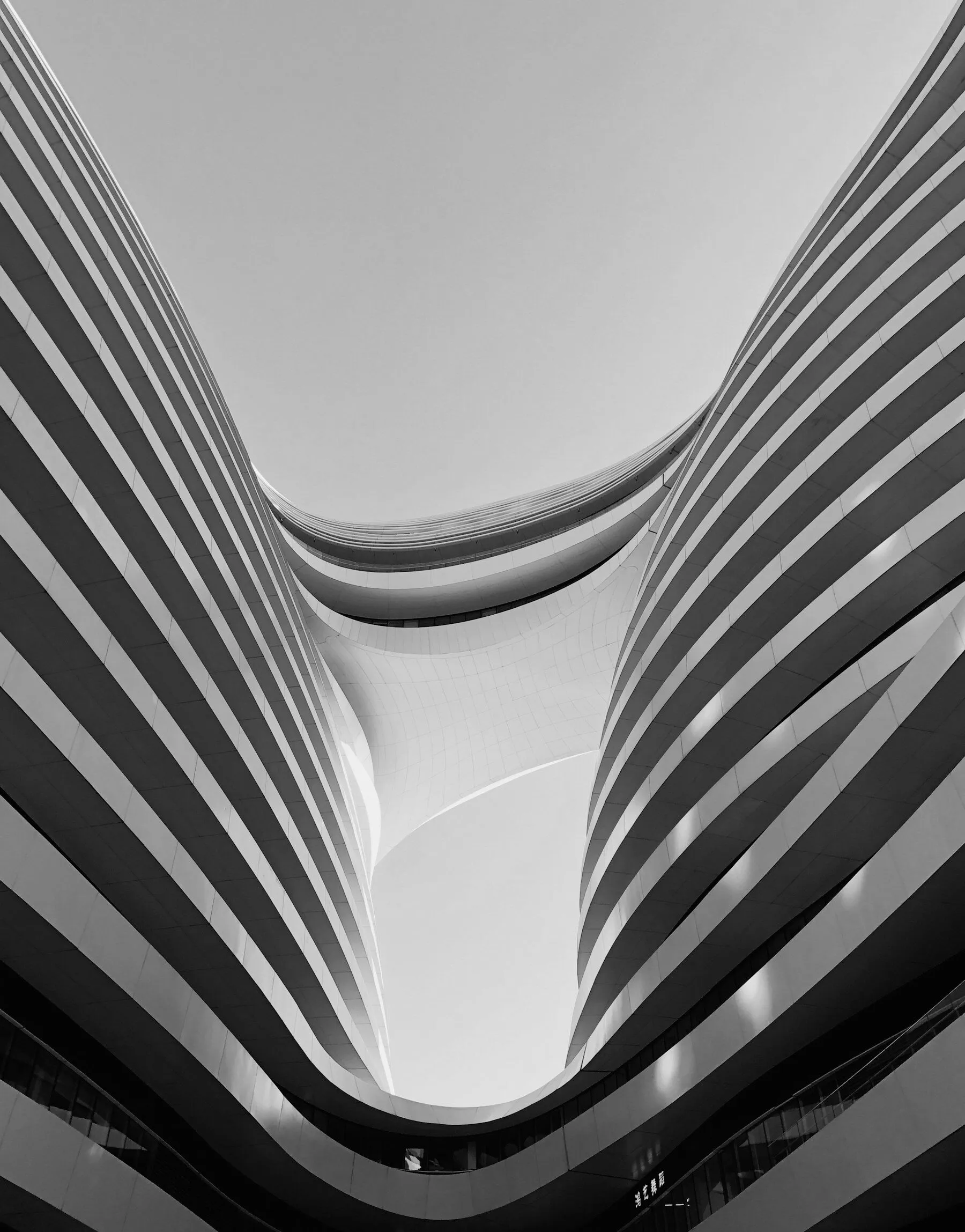 Curving balconies of a tower against the sky