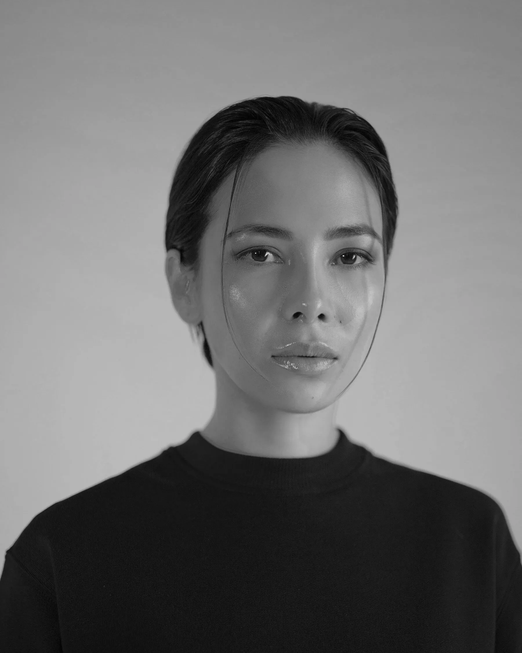 Portrait of a woman with slicked-back hair